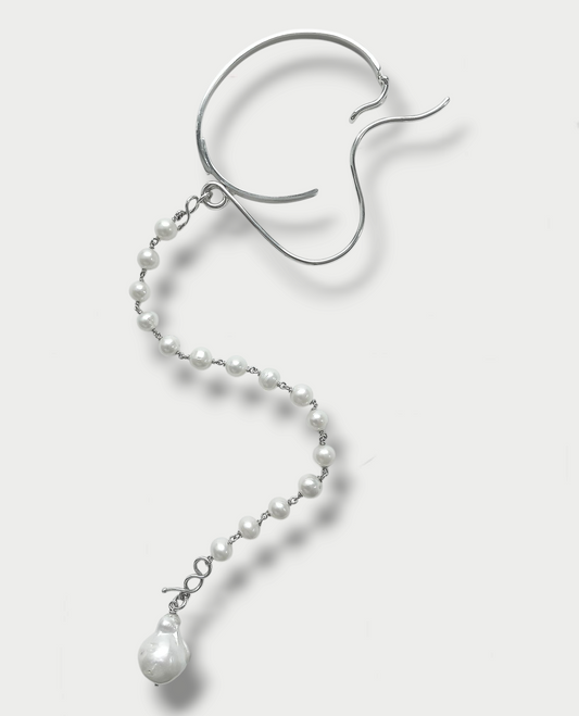 Anthony Was Here silver bracelet with a baroque pearl drop and a trail of pearls.