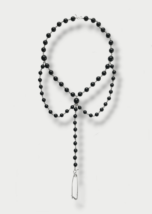 Anthony Was Here black onyx necklace with a safety pin drop and silver (925) detailing, displayed against a white background.