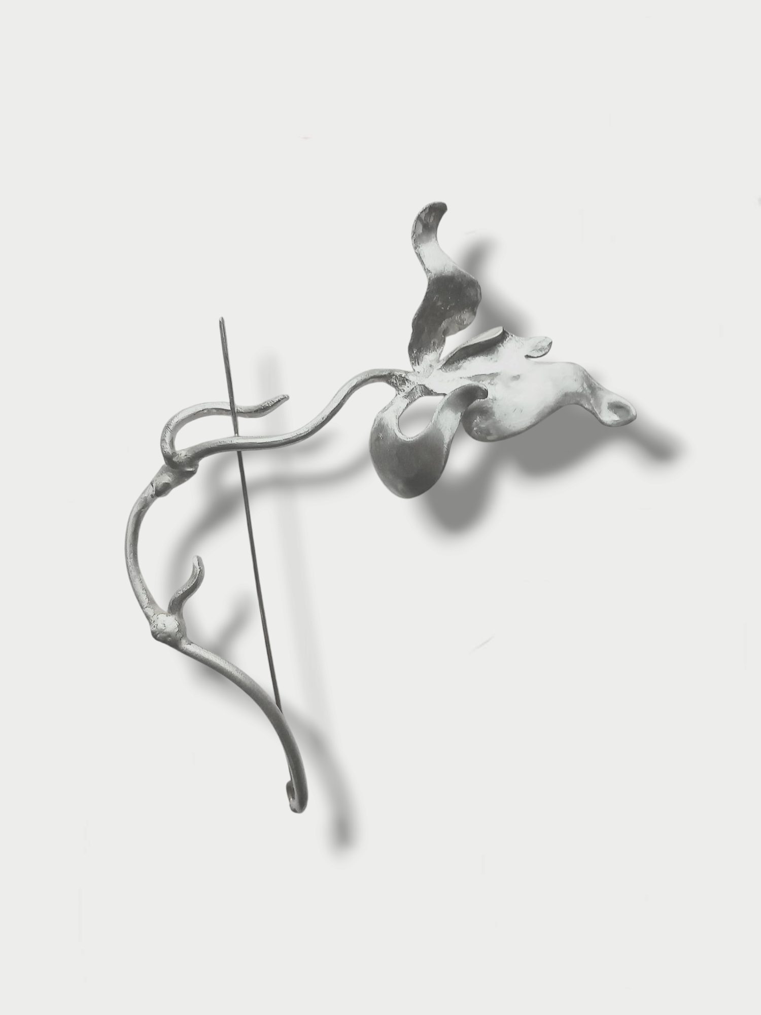 Anthony Was Here silver (925) brooch designed in the shape of a wild orchid on light background