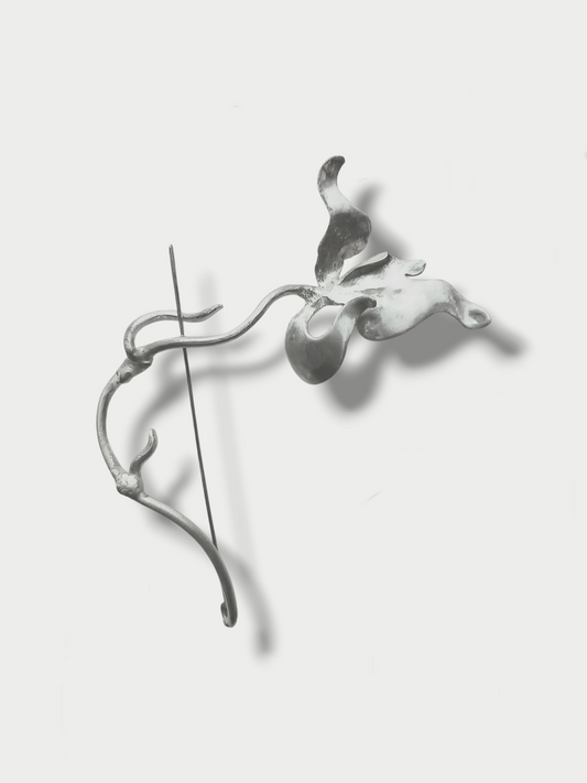 Anthony Was Here silver (925) brooch designed in the shape of a wild orchid on light background