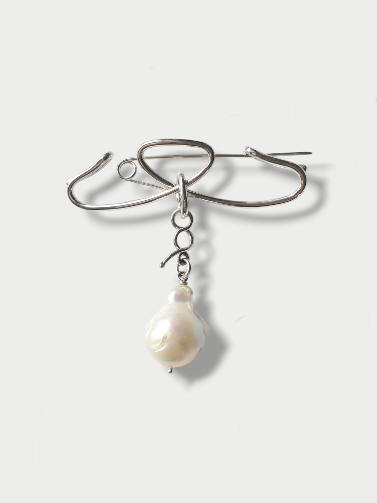 art deco' inspired statement lapel pin in silver (925) and baroque pearl drop